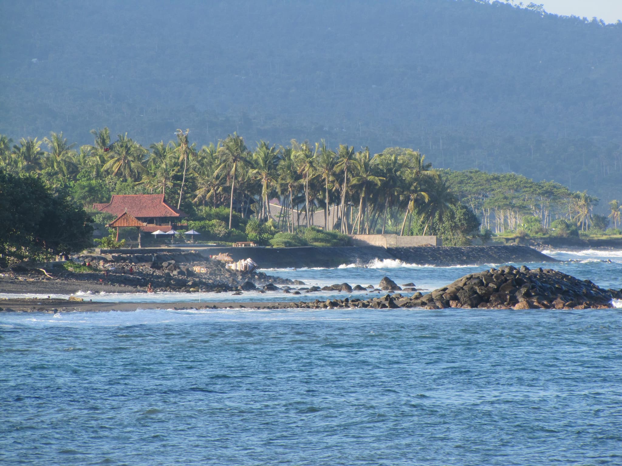 Surfing at Jasri bach in eastern Bali