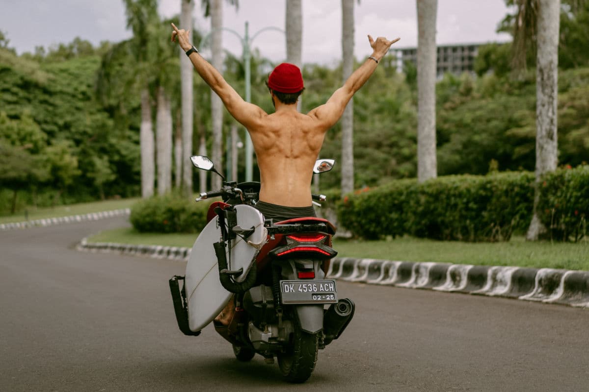 Tourist In Bali not wearing a shirt or helmet