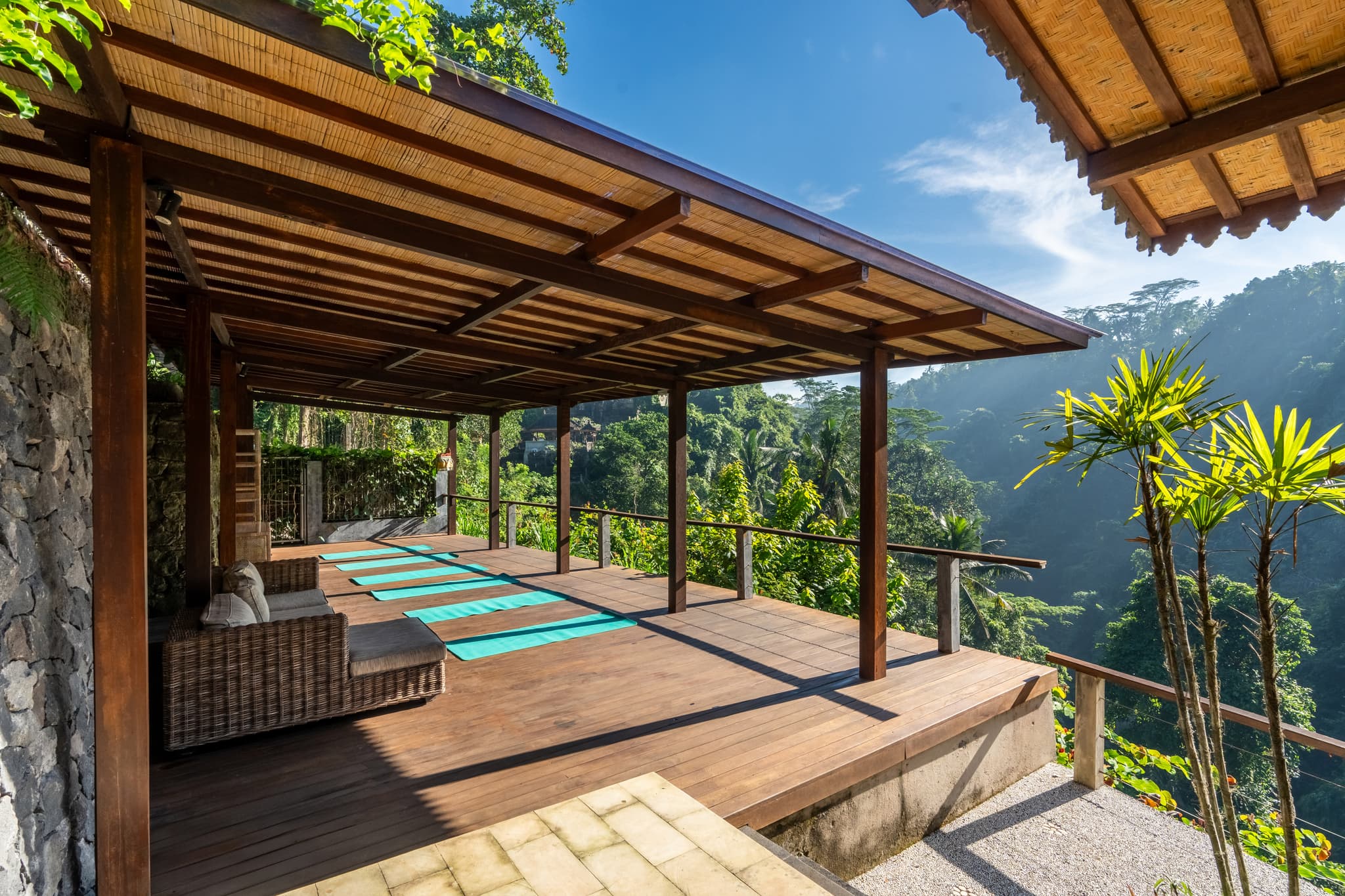 Villa Sagitta - yoga deck with wooden floor and spectacular views of the village temple and Ubud jungle