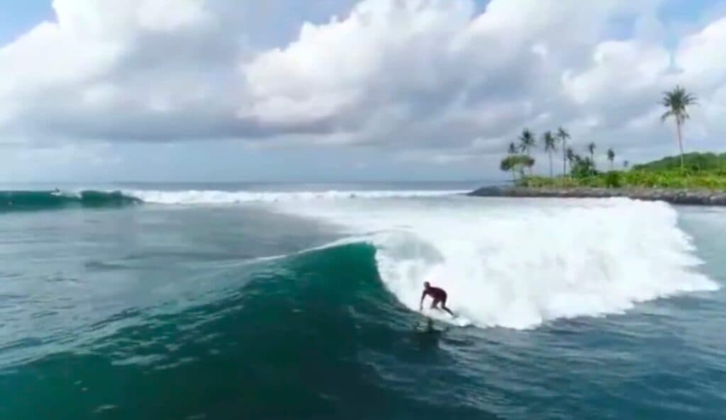 Surfing at Jasri bach in eastern Bali