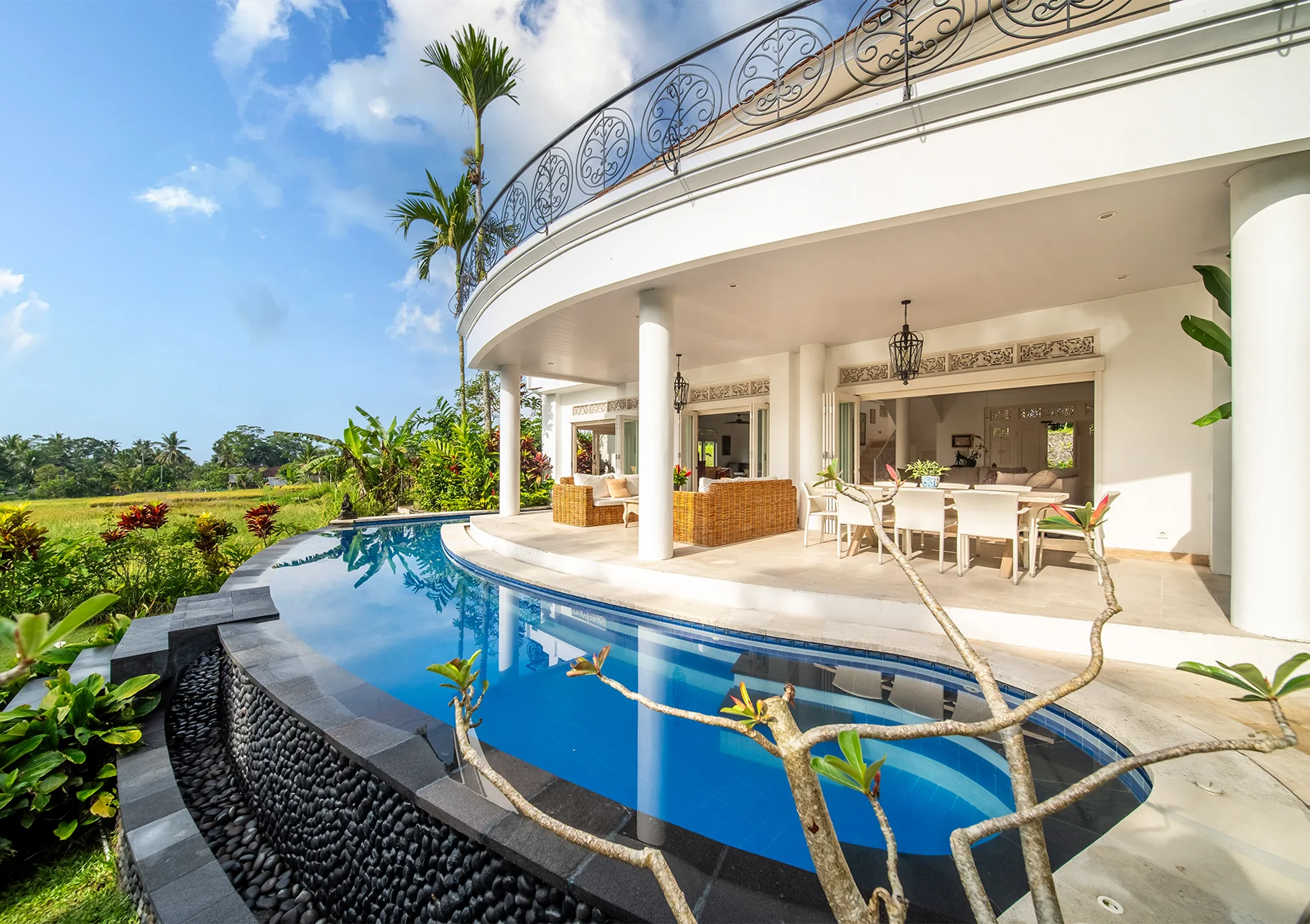 4-bedroom family villa in Bali with private pool and rice field views.
