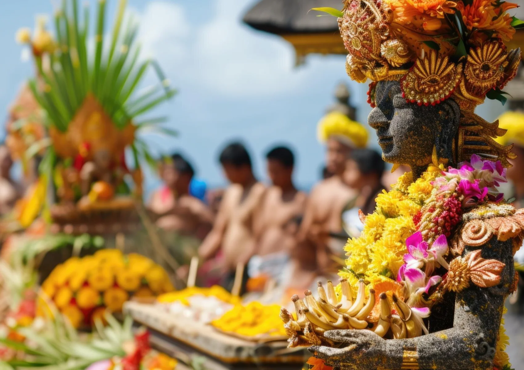 Traditional Balinese offering ceremony with flower decorations, fruit offerings, and Hindu ritual preparations at a temple in Bali.