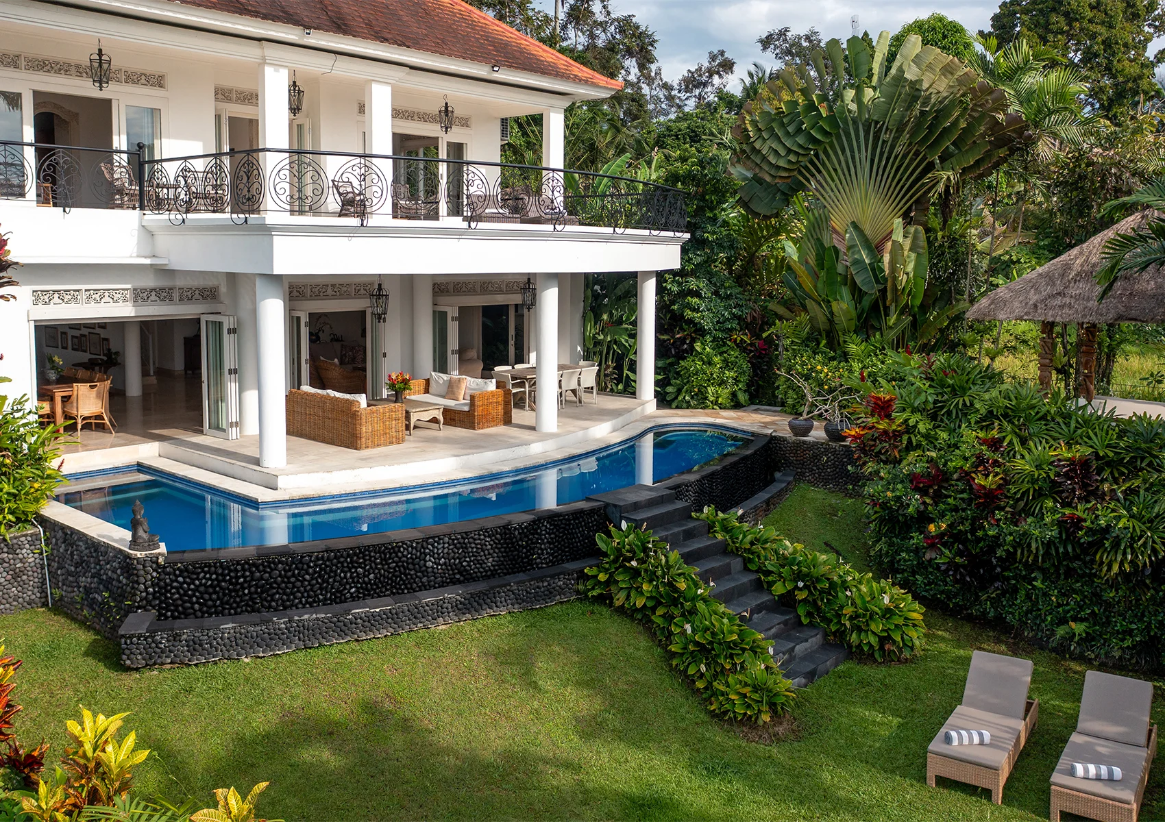 Family villa in Ubud with private pool, tropical garden, and spacious outdoor area.