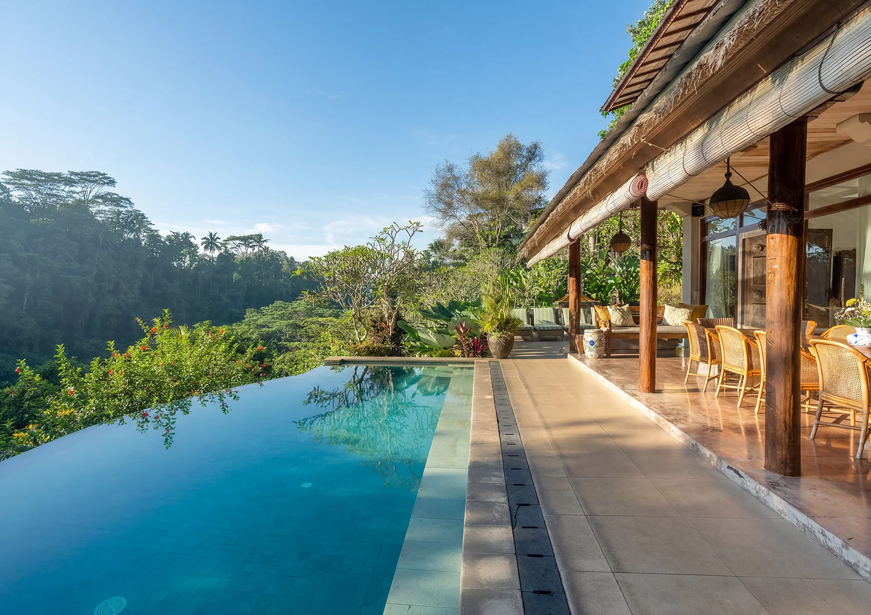 Family villa Bali with infinity pool overlooking tropical jungle near Ubud